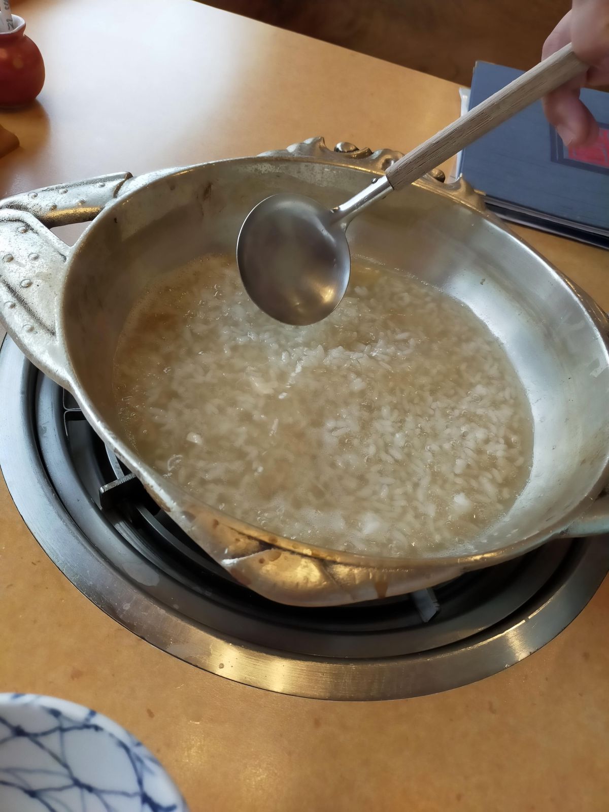 雑炊調理中